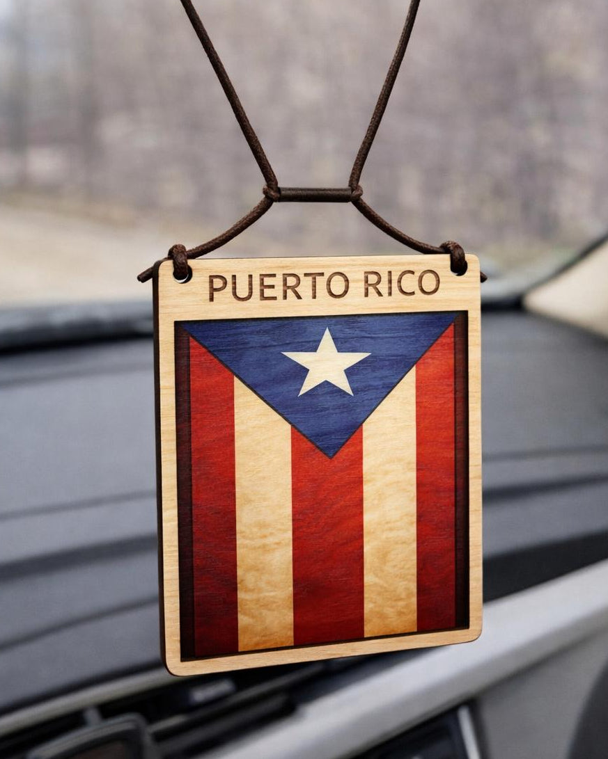 Puerto Rican flag car air freshener hanging from a car's rearview mirror.