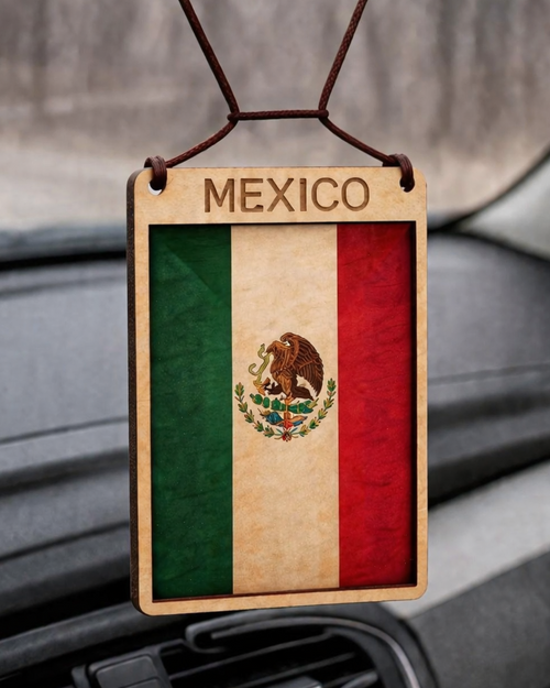 Mexico flag car air freshener hanging from a car's rearview mirror.